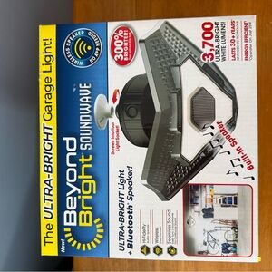 New In Box, Never Opened, The Ultra Bright Garage Light With Wireless Speaker